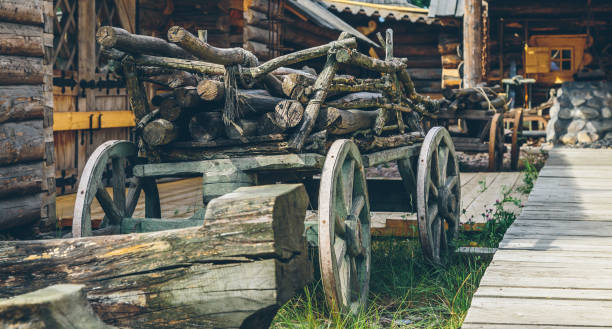 old wooden cart with firewood close-up