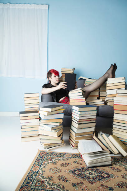 istock Young lady with dyed hair studying 983593350