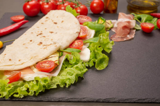 istock Piadina romagnola with cheese and ham 983601074