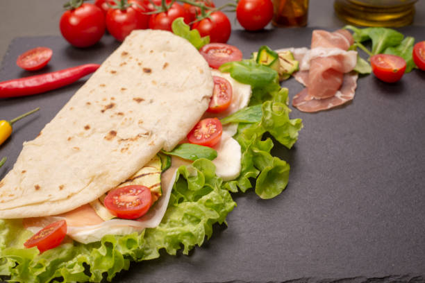 istock Piadina romagnola with cheese and ham 983601288