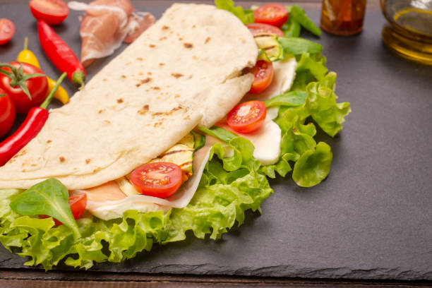 istock Piadina romagnola with cheese and ham 983601678