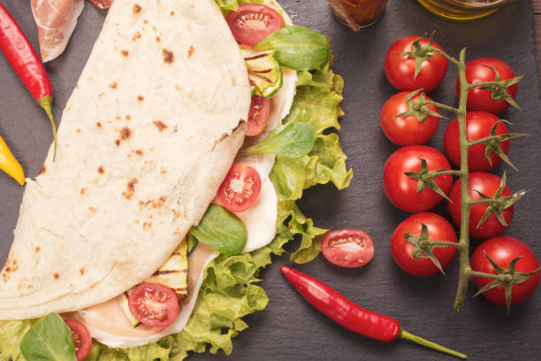 istock Piadina romagnola with cheese and ham 983601724