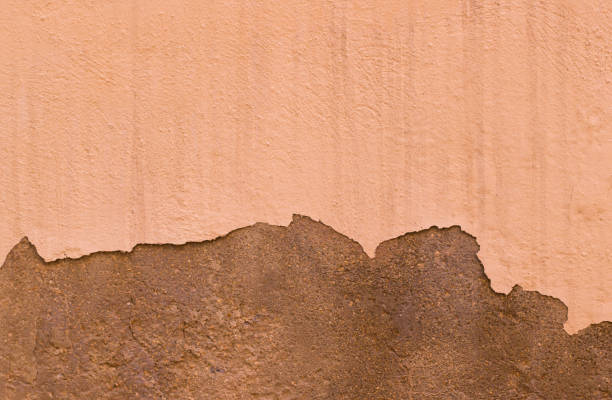 istock Damaged Painted Beige Brown Old Wall Background Texture 983614012