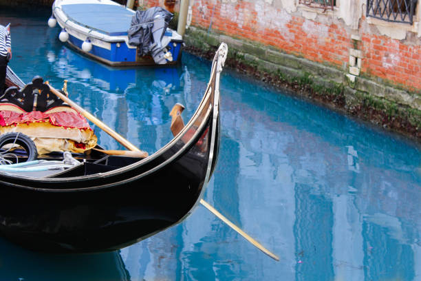 The charm of the lagoon city in the reflections of its canals and in the gondolas that navigate them