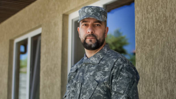 istock Serious bearded man in camouflage uniform 983636942