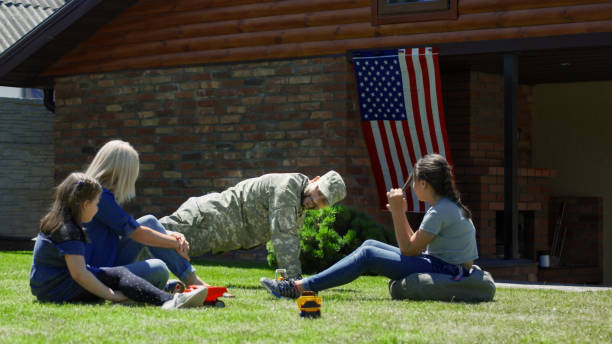 istock Military man with family in backyard 983637168