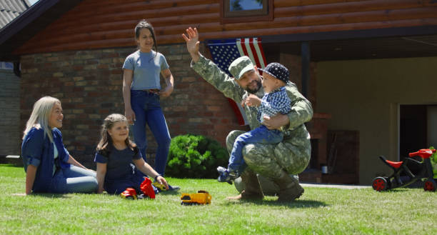 istock Military man spending time with family 983637190