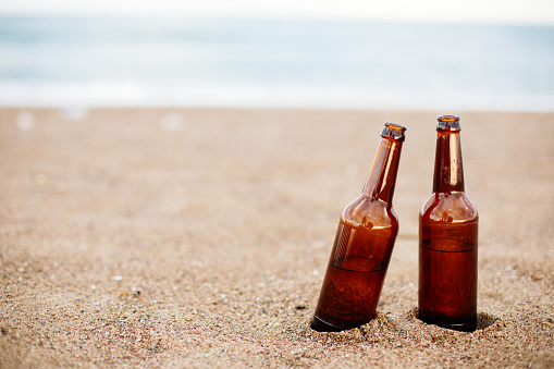 Two Bottles beer on sandy beach
