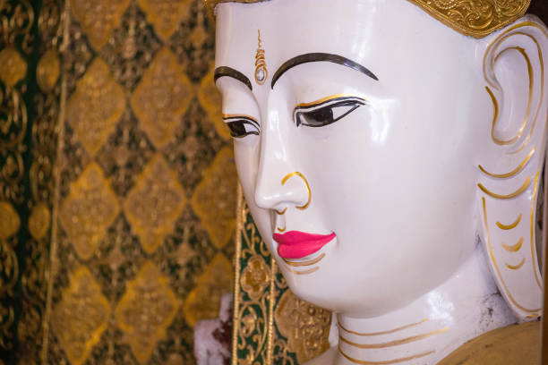 A statue of Buddha at the Shwedagon Pagoda (aka Shwedagon Zedi Daw, Great Dagon Pagoda, or Golden Pagoda) in Yangon.