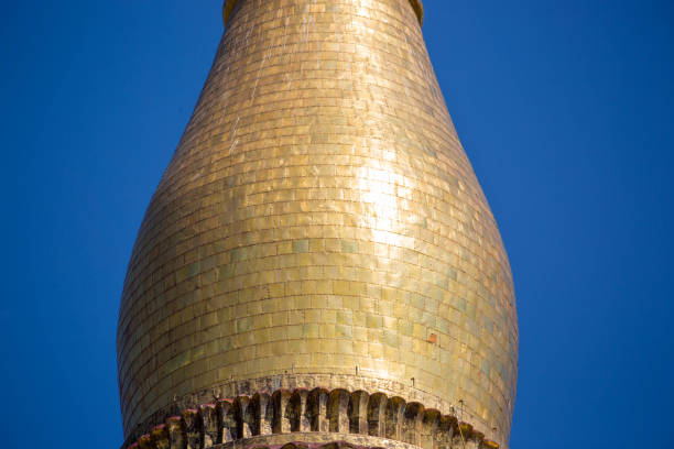 Detail of the banana bud section of the Shwedagon Pagoda (aka Shwedagon Zedi Daw, Great Dagon Pagoda, or Golden Pagoda), covered in solid gold plates.