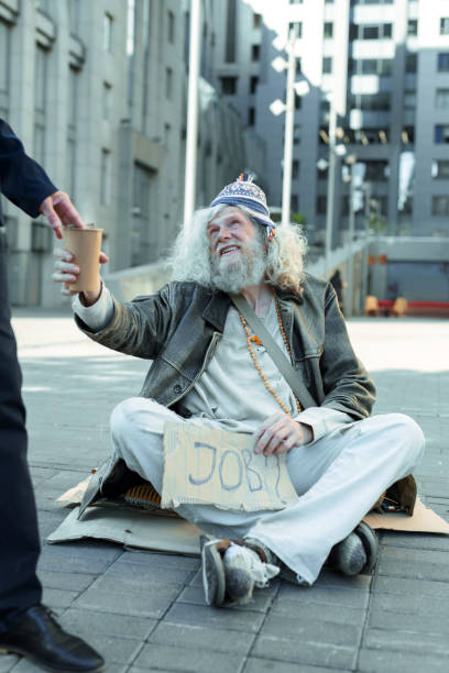 istock Homeless vagrant searching for any job 983668532