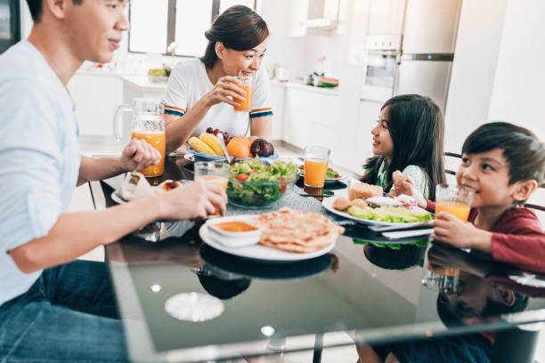 istock Family with two kids having breakfast 983676230