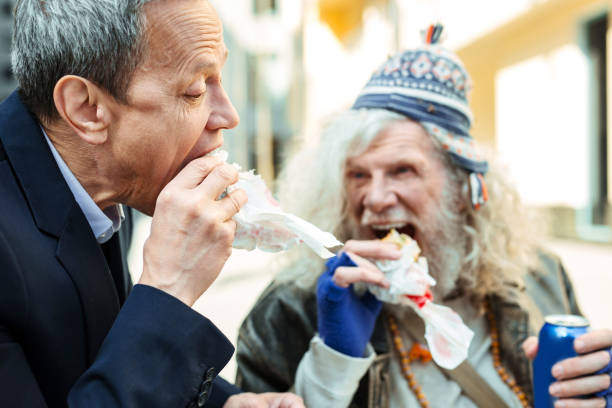 istock Businessman spending his break time with nice refugee 983696190