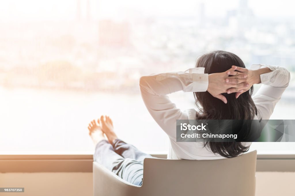 Simple life style relaxation with Asian working business woman healthy lifestyle take it easy resting in comfort hotel or home living room having free time with peace of mind and self health balance Relaxation Stock Photo
