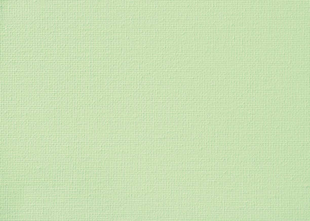 istock Canvas burlap fabric texture background for painting in lime green pastel color 983710142