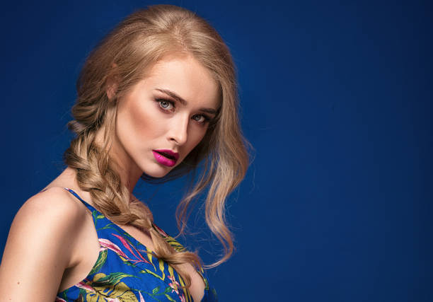 istock Beautiful blonde girl with braid and glamour makeup. 983722952