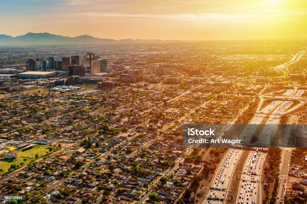 Phoenix Aerial at Dusk An aerial view of downtown Phoenix, Arizona and the surrounding urban area from an altitude of about 2000 feet over the desert floor during the hours of dusk. Heat - Temperature Stock Photo