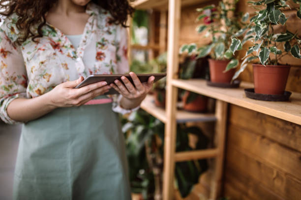 istock Florist Woman Checking Her Personal Planer 983734938