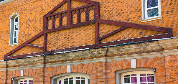 Windows and orange brick walls.