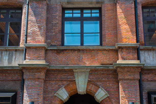 istock External windows of red brick walls. 983743238