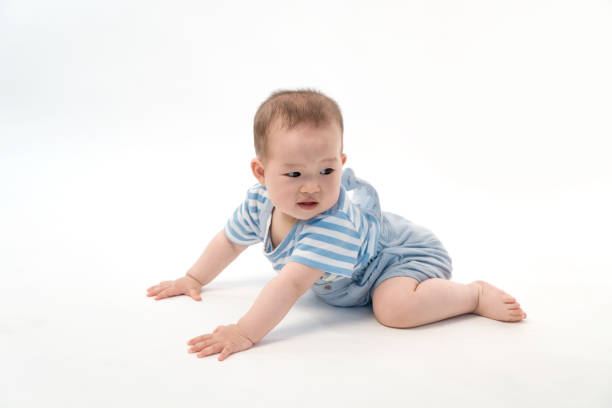 istock The baby was sitting on the floor playing 983775902