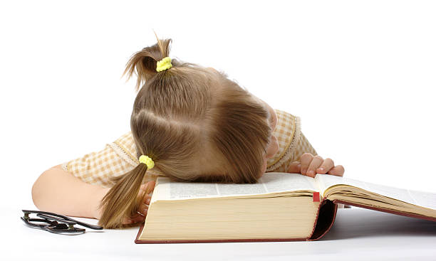 istock Little girl is sleeping on book, back to school 98378635