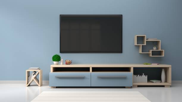 istock TV on the blue wall in modern living room 983793518