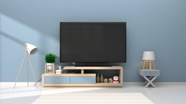 istock Mock up TV room in room interior blue wall background 983793522