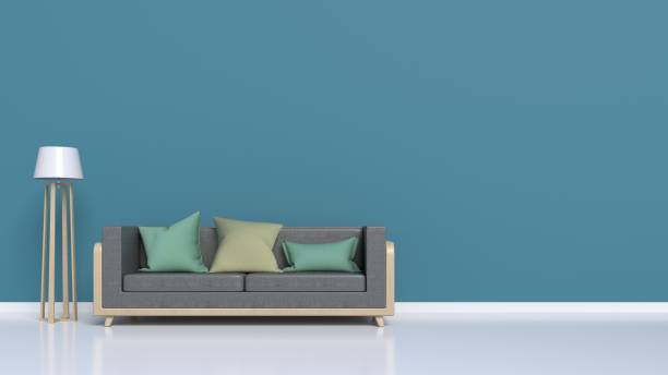 istock Living Room Interior with sofa, pillows, lamp, on empty dark wall background 983793536