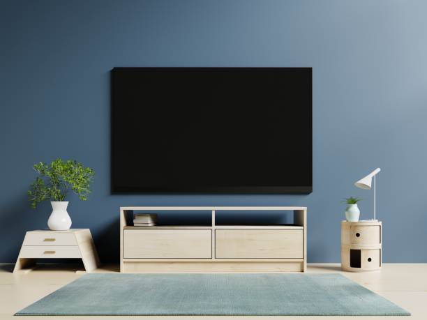 istock Tv in modern empty room and dark wall background 983793584
