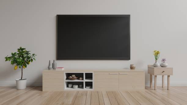 istock TV on cabinet in bright room,white wall background 983793662