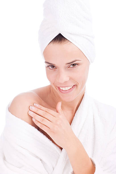 istock Girl putting cream on her shoulder 98379700