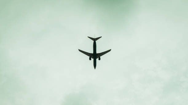 istock Close-up of an airplane in the sky 983800546