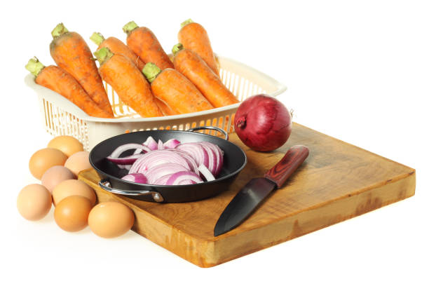 Raw eggs ，Carrot and red onion  on white background