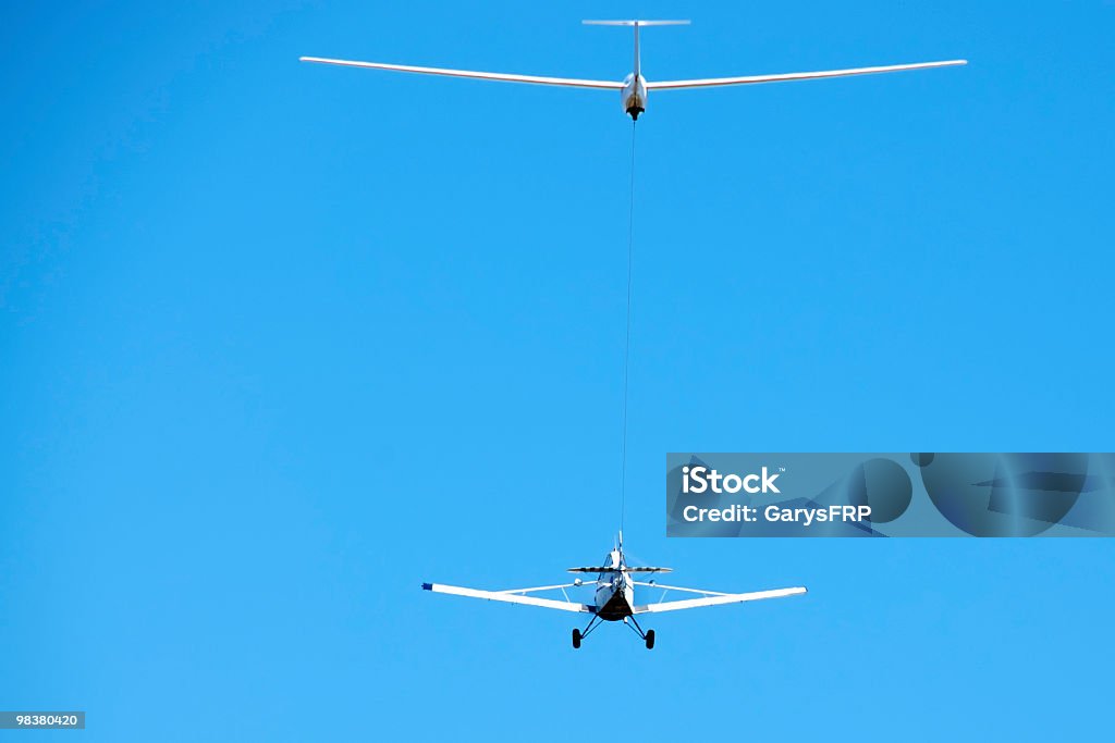 Glider and Tow PLane in Flight with Blue Sky  Glider Stock Photo