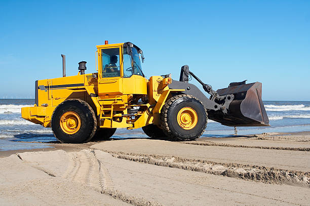 ショベルカー海で - glade land construction vehicle built structure ストックフォトと画像