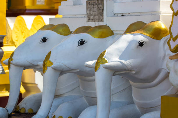A row of elephant statues at the base of the Shwedagon Pagoda in Yangon.