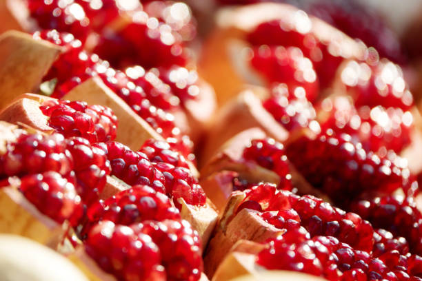 istock Group of pomegranates. Pomegranate closeup, background 983869218