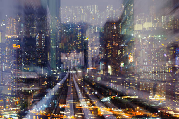 istock Night motion train track over blurred bokeh city residence downtown light 983872546