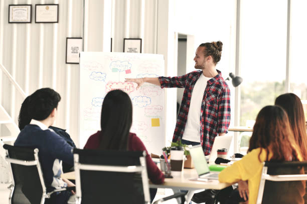 istock Young businessman giving presentation 983872996