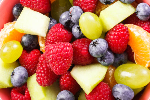 istock Fresh prepared fruit salad as background, healthy nutrition concept 983885410