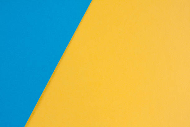 istock Yellow and blue color paper texture background 983901060