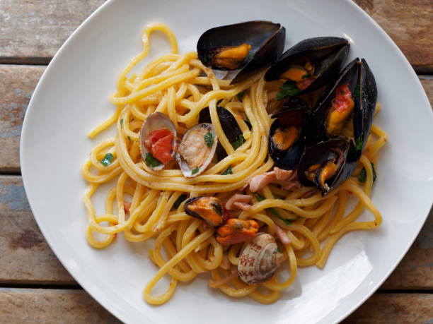 istock top view spaghetti pasta with seafood dish 983901976