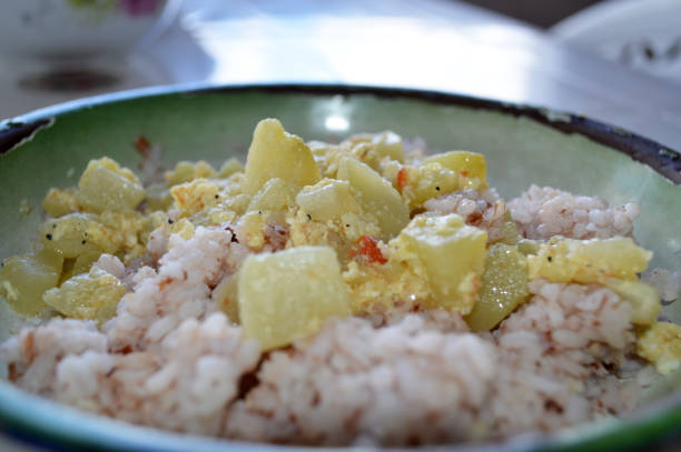 Egg Christophine mixed with red rice Vegetarian meal: Christophine with eggs in a bowl mixed with red rice. Christophine stock pictures, royalty-free photos & images