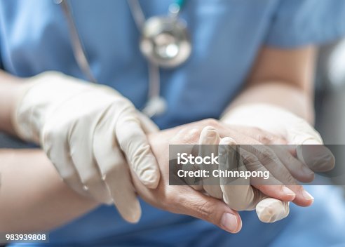 istock Surgeon, surgical doctor, anesthetist or anesthesiologist holding patient's hand for health care trust and support in professional surgical operation, medical anesthetic safety, healthcare concept 983939808