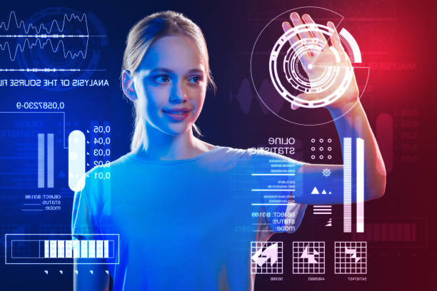 istock Creative girl smiling and looking at the icon on the screen 983940004