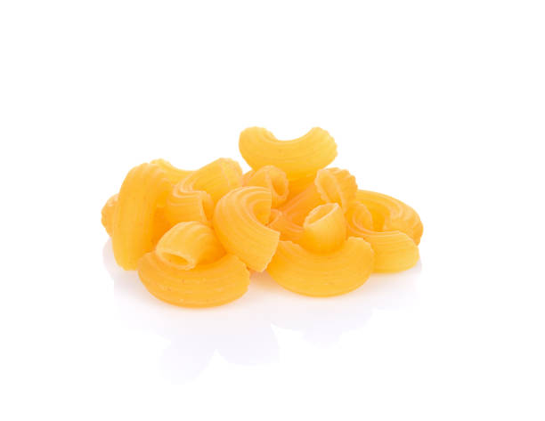 istock macaroni pasta close up isolated on white background 983943258