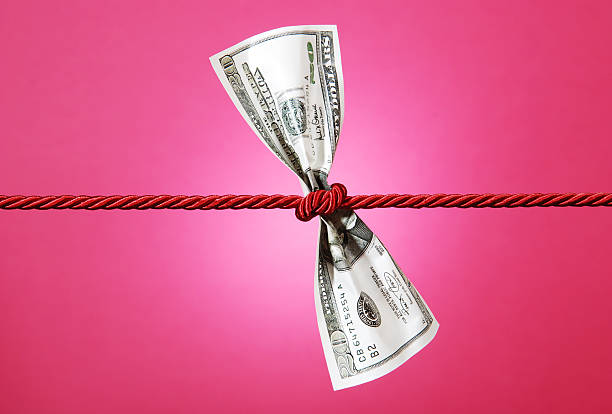 istock Tug of war with dollar 98395370