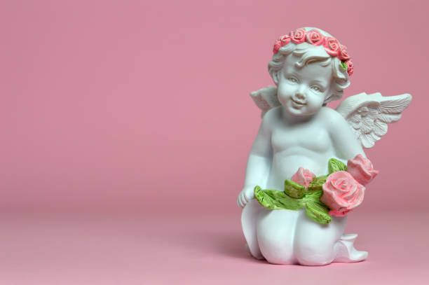 istock Guardian angel holding flowers 983958640