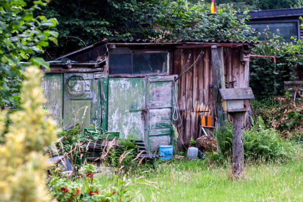 istock Rustic old garden shed in typical German Garden 983975190